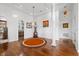 Entryway with hardwood floors, decorative rug, and views of the living spaces at 4128 Causeway Vista Dr, Tampa, FL 33615