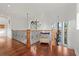 Spacious foyer with hardwood floors and decorative railing with outdoor views at 4128 Causeway Vista Dr, Tampa, FL 33615