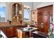 Gourmet kitchen with custom wood cabinets, modern appliances, and a center island perfect for entertaining at 4128 Causeway Vista Dr, Tampa, FL 33615