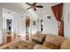 Bright living room boasts hardwood floors, open layout, and cozy seating at 4128 Causeway Vista Dr, Tampa, FL 33615