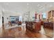 Open-concept living space featuring hardwood floors and kitchen counter with bar stools at 4128 Causeway Vista Dr, Tampa, FL 33615