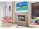 Cozy living room featuring a stone fireplace and scenic views, ideal for relaxing or entertaining guests at 4128 Causeway Vista Dr, Tampa, FL 33615