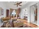 Inviting living room boasts hardwood floors, bright windows, and adjacent bedrooms at 4128 Causeway Vista Dr, Tampa, FL 33615