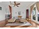 Spacious living room with stylish decor, ceiling fan, and hardwood floors at 4128 Causeway Vista Dr, Tampa, FL 33615