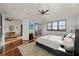 Sun-drenched main bedroom featuring hardwood floors, sitting area, and private balcony at 4128 Causeway Vista Dr, Tampa, FL 33615