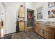 Practical mudroom with tile flooring, storage cabinets, and a walk-in shower area at 4128 Causeway Vista Dr, Tampa, FL 33615