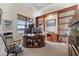 Bright home office with custom built-ins, a large desk, and a view of the water at 4128 Causeway Vista Dr, Tampa, FL 33615