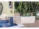 Backyard pool and spa with stone accents, waterfall feature, and wooden deck at 4128 Causeway Vista Dr, Tampa, FL 33615