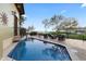 Stunning pool area with comfortable seating and beautiful water views creating a serene setting at 4128 Causeway Vista Dr, Tampa, FL 33615