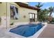 Stunning pool area featuring a spa, outdoor shower, and lush landscaping, creating a private oasis for relaxation at 4128 Causeway Vista Dr, Tampa, FL 33615