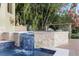 Beautiful pool area with a lovely waterfall feature, lush landscaping, and a serene setting for relaxation and enjoyment at 4128 Causeway Vista Dr, Tampa, FL 33615