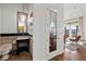 Chic powder room showcases stone wall tiles, modern fixtures, and convenient access to the main living area at 4128 Causeway Vista Dr, Tampa, FL 33615