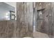 Tiled shower with a built in shelf and white tiled floor at 4128 Causeway Vista Dr, Tampa, FL 33615