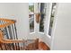 Bright foyer with a wooden staircase featuring a decorative light fixture at 4128 Causeway Vista Dr, Tampa, FL 33615