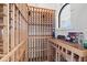 Spacious wine cellar with custom wooden racking for storing and displaying a wide variety of wines at 4128 Causeway Vista Dr, Tampa, FL 33615