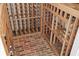This custom wine cellar boasts a unique brick floor and custom wooden racking, combining style and functionality at 4128 Causeway Vista Dr, Tampa, FL 33615