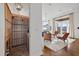 Lovely wine cellar features ample wooden shelving and a brick floor, blending rustic charm with modern luxury at 4128 Causeway Vista Dr, Tampa, FL 33615