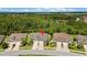 Scenic aerial view of a home with a beautiful yard, surrounded by lush greenery at 4155 Barletta Ct, Wesley Chapel, FL 33543