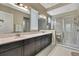 Modern bathroom showcasing a glass shower, double vanity, and a bright, clean design at 4155 Barletta Ct, Wesley Chapel, FL 33543