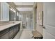 Contemporary bathroom features a glass shower, sleek vanity, and a well-lit, functional space at 4155 Barletta Ct, Wesley Chapel, FL 33543