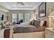 Bright bedroom featuring a decorative ceiling fan, natural light, and cozy decor at 4155 Barletta Ct, Wesley Chapel, FL 33543