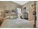 Cozy bedroom with a four-poster bed, personal photos, and a bathroom at 4155 Barletta Ct, Wesley Chapel, FL 33543