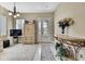 Inviting foyer with a decorative table, beautiful flooring, and ample natural light at 4155 Barletta Ct, Wesley Chapel, FL 33543