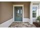 Elegant front door with decorative glass, complemented by a paver walkway at 4155 Barletta Ct, Wesley Chapel, FL 33543