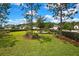 Beautifully landscaped park with mature trees, green lawns, and inviting bench seating at 4155 Barletta Ct, Wesley Chapel, FL 33543