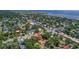 Aerial view of the property location near the city and ocean, surrounded by mature trees at 4714 W Vasconia St, Tampa, FL 33629