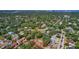 Property aerial view showcasing spacious lot surrounded by mature trees within a quiet residential neighborhood at 4714 W Vasconia St, Tampa, FL 33629