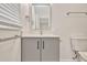 Modern bathroom featuring gray vanity with modern fixtures, offering a clean and stylish design at 4714 W Vasconia St, Tampa, FL 33629