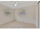 Cozy bedroom featuring ample natural light, neutral decor, and a comfortable, inviting atmosphere at 4714 W Vasconia St, Tampa, FL 33629