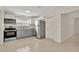 Well-lit kitchen with stainless steel appliances, ample cabinet space, and a clean, functional layout at 4714 W Vasconia St, Tampa, FL 33629