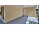 View of a covered porch, an entryway, and yellow siding at 4714 W Vasconia St, Tampa, FL 33629