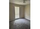 Bedroom featuring soft carpet, a large window for natural light, and ceiling fan at 4793 Pleasant Ave, Palm Harbor, FL 34683