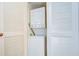 Laundry closet with stacked washer and dryer, and louvered doors at 4801 Airport Rd # 211, Zephyrhills, FL 33542