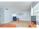 Spacious living room with wood flooring and an abundance of natural light at 4801 Airport Rd # 211, Zephyrhills, FL 33542