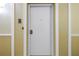 Hallway view of a condo door with unit number at 4900 Brittany S Dr # 611, St Petersburg, FL 33715