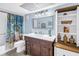 Charming bathroom with decorative vanity, updated fixtures, and plenty of storage space at 4900 Brittany S Dr # 611, St Petersburg, FL 33715