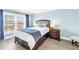 Serene bedroom with a cozy bed, soft lighting, and a bright window at 4900 Brittany S Dr # 611, St Petersburg, FL 33715