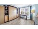 Bedroom with custom built-in storage, desk, and bright window overlooking a picturesque view at 4900 Brittany S Dr # 611, St Petersburg, FL 33715
