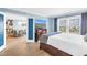 Primary bedroom with an open layout and a door leading to a bright living room and balcony views at 4900 Brittany S Dr # 611, St Petersburg, FL 33715