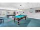Inviting billiard room featuring two pool tables and a comfortable seating area for entertainment at 4900 Brittany S Dr # 611, St Petersburg, FL 33715