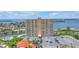 High-rise condo building showcases amazing water views, a parking lot, and lush landscaping at 4900 Brittany S Dr # 611, St Petersburg, FL 33715