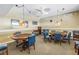 Resident game room with card tables and chairs at 4900 Brittany S Dr # 611, St Petersburg, FL 33715