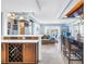 Inviting open-concept living space with a bar, wine rack, and panoramic views of the water at 4900 Brittany S Dr # 611, St Petersburg, FL 33715