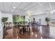 Bright meeting room featuring a tropical mural, hardwood floors, and tables for gatherings at 4900 Brittany S Dr # 611, St Petersburg, FL 33715
