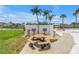 Community picnic area with barbecues, picnic table, and waterfront views create an inviting outdoor experience at 4900 Brittany S Dr # 611, St Petersburg, FL 33715