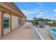 Inviting poolside patio with seating and lush landscaping, perfect for relaxing and entertaining at 4900 Brittany S Dr # 611, St Petersburg, FL 33715